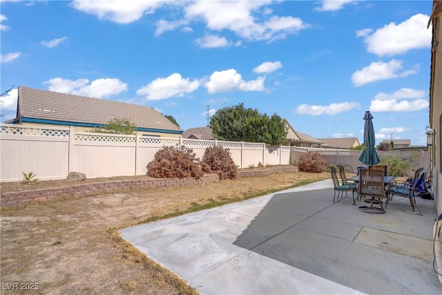 5630 Midnight Breeze St, North Las Vegas, NV 89081 - fenced backyard with a patio area and outdoor dining area