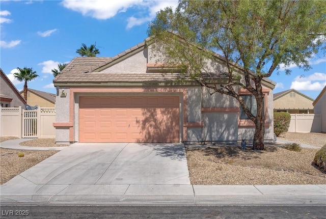 5630 Midnight Breeze St, North Las Vegas, NV 89081 - view of front of house with driveway, an attached garage, a tile roof, and stucco siding