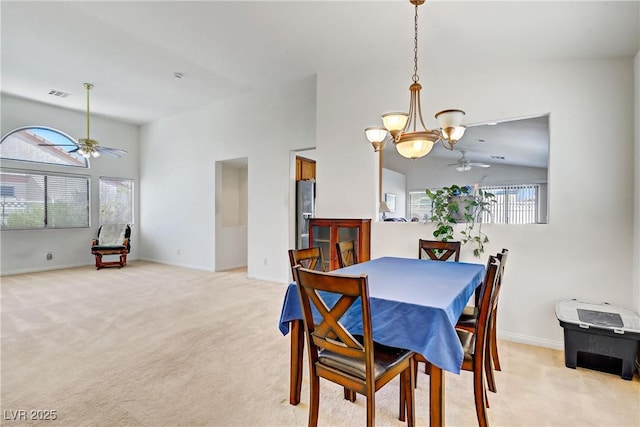 5630 Midnight Breeze St, North Las Vegas, NV 89081 - dining room featuring a ceiling fan, light carpet, and a chandelier