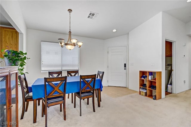 5630 Midnight Breeze St, North Las Vegas, NV 89081 - dining area with a chandelier and light carpet