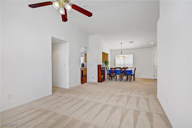 5630 Midnight Breeze St, North Las Vegas, NV 89081 - living room with light carpet, a ceiling fan, a chandelier, and recessed lighting
