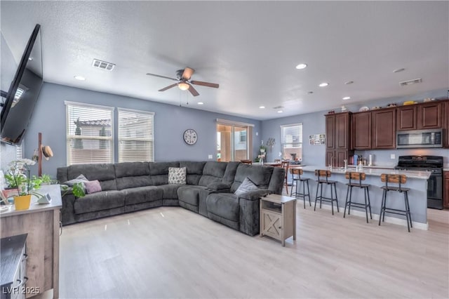 8104 Switchback Run St, Las Vegas, NV 89166 - living room featuring light wood finished floors, recessed lighting, and a ceiling fan