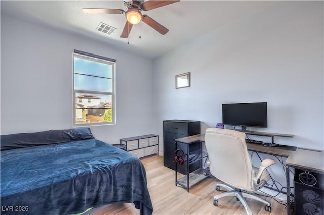 8104 Switchback Run St, Las Vegas, NV 89166 - bedroom with light wood finished floors, an office area, and a ceiling fan