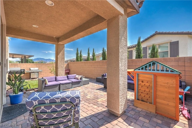 8104 Switchback Run St, Las Vegas, NV 89166 - fenced backyard with outdoor lounge area and a patio area