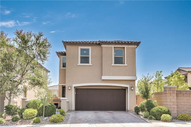 8104 Switchback Run St, Las Vegas, NV 89166 - mediterranean / spanish house with an attached garage, stucco siding, driveway, and a tile roof