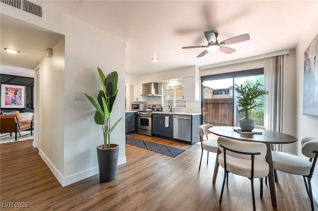 1467 Hialeah Dr Unit C, Las Vegas, NV 89119 - dining room featuring ceiling fan and wood finished floors