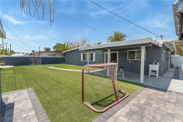 1905 Las Verdes St, Las Vegas, NV 89102 - rear view of property with a fenced backyard, a patio area, and stucco siding