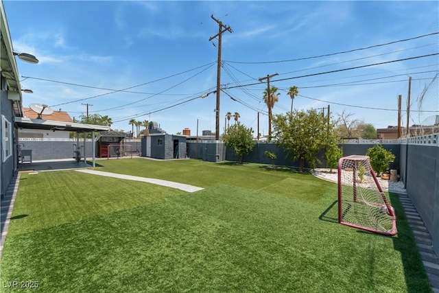 1905 Las Verdes St, Las Vegas, NV 89102 - fenced backyard with a storage unit