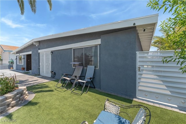 1905 Las Verdes St, Las Vegas, NV 89102 - rear view of property featuring stucco siding and a patio