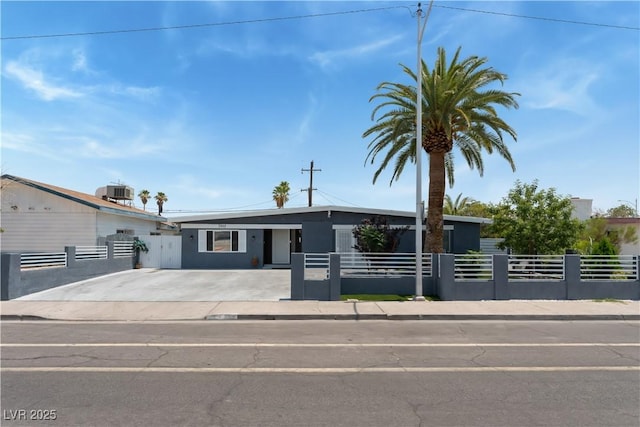 1905 Las Verdes St, Las Vegas, NV 89102 - view of front of house with a fenced front yard, a gate, and stucco siding