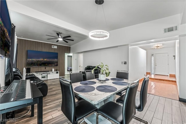 1905 Las Verdes St, Las Vegas, NV 89102 - dining area with wood finished floors, an accent wall, and ceiling fan