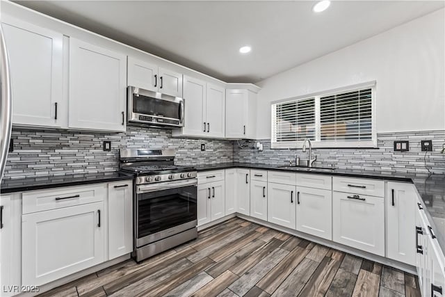1905 Las Verdes St, Las Vegas, NV 89102 - kitchen with stainless steel appliances, dark countertops, tasteful backsplash, and recessed lighting