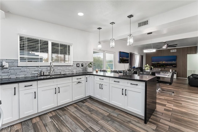 1905 Las Verdes St, Las Vegas, NV 89102 - kitchen with open floor plan, dark countertops, a ceiling fan, decorative backsplash, and recessed lighting