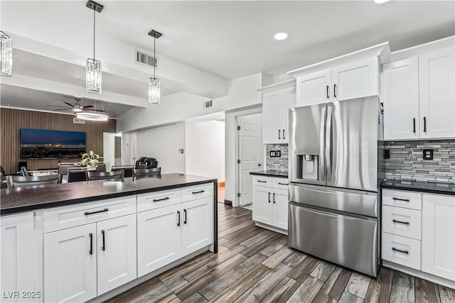 1905 Las Verdes St, Las Vegas, NV 89102 - kitchen with stainless steel refrigerator with ice dispenser, ceiling fan, dark countertops, white cabinetry, and dark wood-style floors