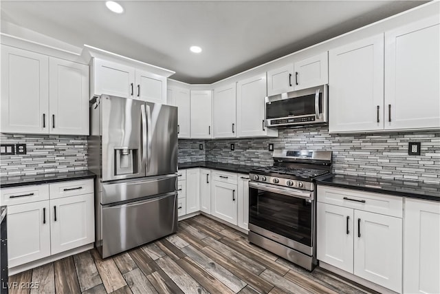 1905 Las Verdes St, Las Vegas, NV 89102 - kitchen featuring stainless steel appliances, dark countertops, white cabinets, tasteful backsplash, and recessed lighting