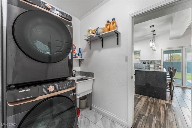 1905 Las Verdes St, Las Vegas, NV 89102 - laundry area featuring stacked washer / dryer and baseboards