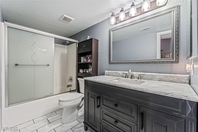 1905 Las Verdes St, Las Vegas, NV 89102 - bathroom featuring vanity, marble finish flooring, bath / shower combo with glass door, a textured ceiling, and a textured wall