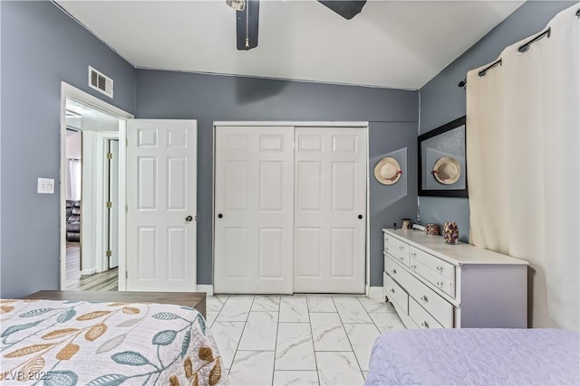 1905 Las Verdes St, Las Vegas, NV 89102 - bedroom with a closet, light marble finish flooring, and a ceiling fan