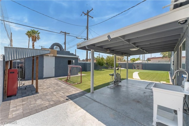 1905 Las Verdes St, Las Vegas, NV 89102 - fenced backyard featuring a patio and an outbuilding
