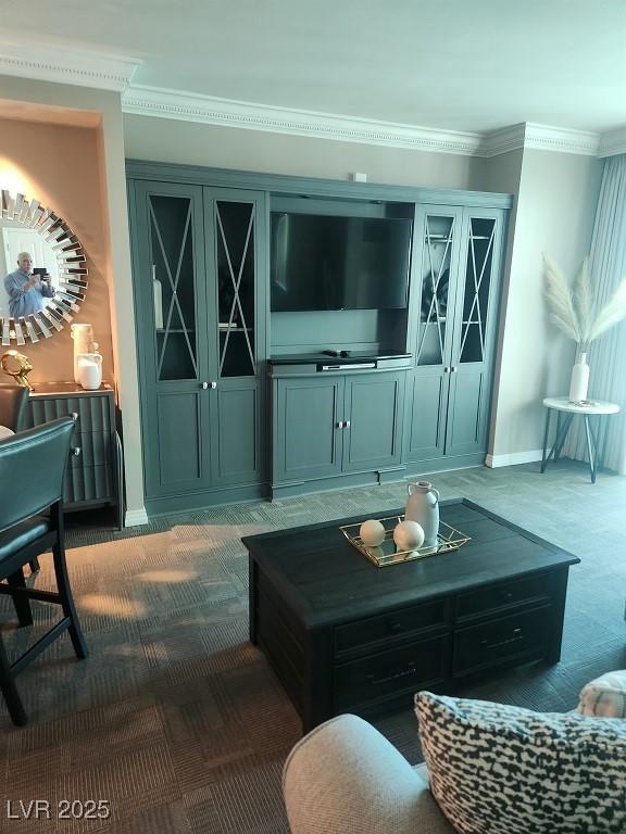 135 E Harmon Ave Unit 2621, Las Vegas, NV 89109 - carpeted living room featuring crown molding and baseboards