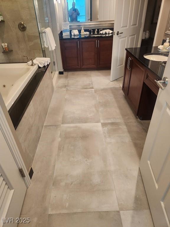 135 E Harmon Ave Unit 2621, Las Vegas, NV 89109 - bathroom with a shower stall, vanity, and a tub with jets