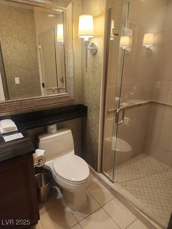 135 E Harmon Ave Unit 2621, Las Vegas, NV 89109 - bathroom with a shower stall and tile patterned floors