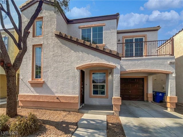 8872 Niche Ave, Las Vegas, NV 89149 - view of front of house featuring a balcony, concrete driveway, stucco siding, and a garage