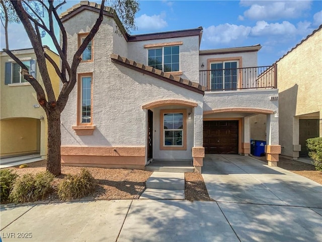 8872 Niche Ave, Las Vegas, NV 89149 - view of front of house with a balcony, concrete driveway, stucco siding, a garage, and a tiled roof