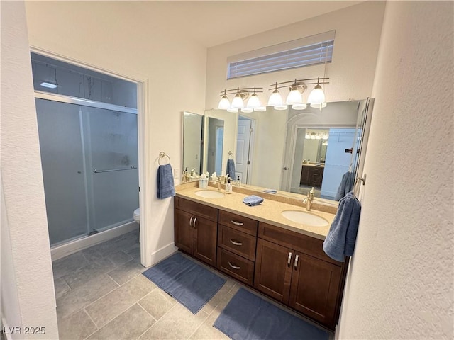 2406 Showcase Dr, Las Vegas, NV 89134 - bathroom featuring double vanity and a shower stall