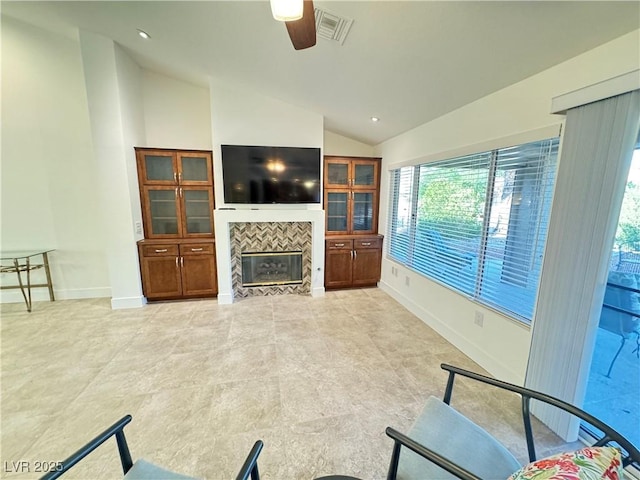 2406 Showcase Dr, Las Vegas, NV 89134 - living room featuring lofted ceiling, ceiling fan, a tile fireplace, and recessed lighting