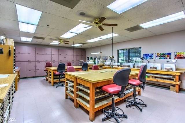2406 Showcase Dr, Las Vegas, NV 89134 - home office with a workshop area, a paneled ceiling, tile patterned floors, and a ceiling fan