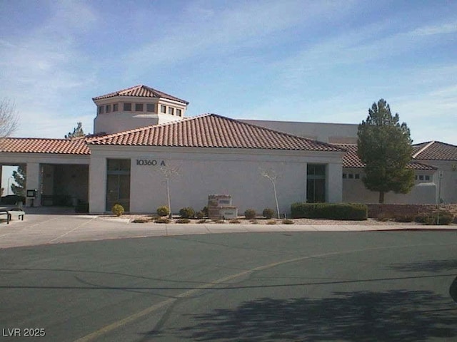 2406 Showcase Dr, Las Vegas, NV 89134 - view of front of property featuring stucco siding and a tiled roof