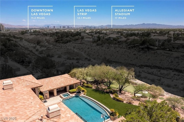9801 Orient Express Ct, Las Vegas, NV 89145 - view of swimming pool featuring a mountain view, a pool with connected hot tub, and a patio