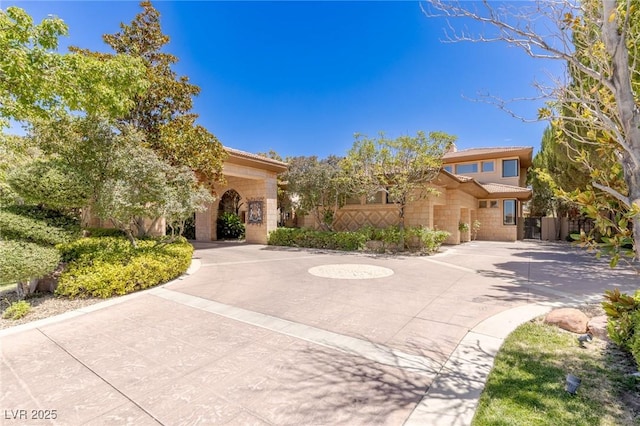 9801 Orient Express Ct, Las Vegas, NV 89145 - view of front of house featuring curved driveway