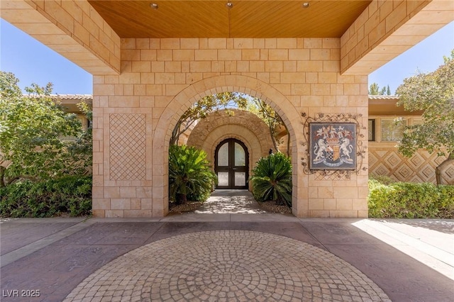 9801 Orient Express Ct, Las Vegas, NV 89145 - property entrance featuring french doors and stone siding