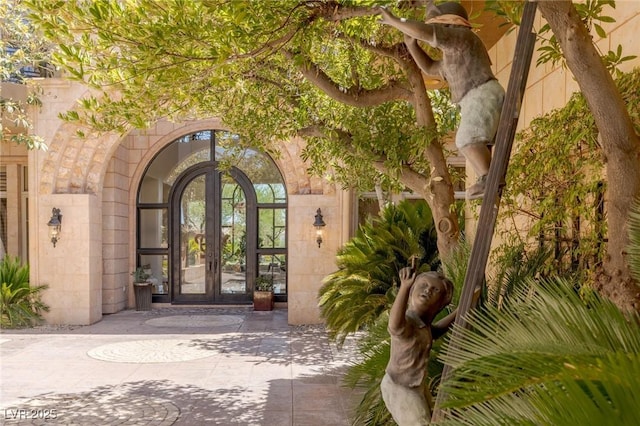 9801 Orient Express Ct, Las Vegas, NV 89145 - entrance to property featuring french doors and stone siding