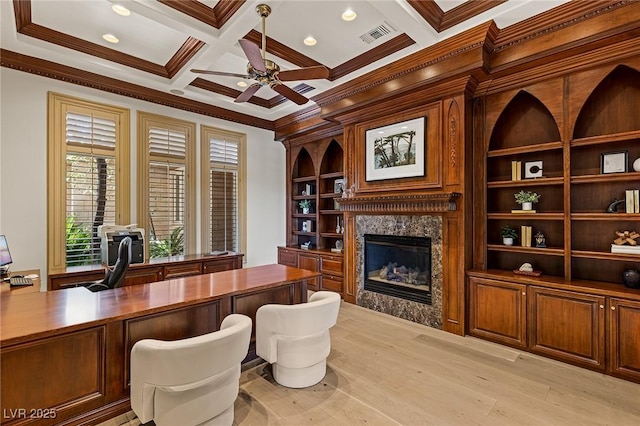 9801 Orient Express Ct, Las Vegas, NV 89145 - home office with a ceiling fan, a premium fireplace, ornamental molding, coffered ceiling, and light wood-style floors