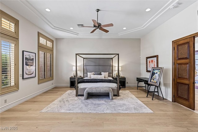 9801 Orient Express Ct, Las Vegas, NV 89145 - bedroom featuring a tray ceiling, light wood finished floors, recessed lighting, and a ceiling fan