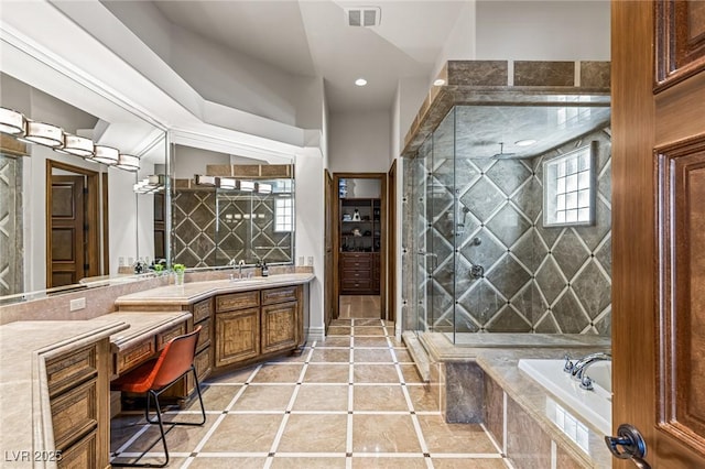 9801 Orient Express Ct, Las Vegas, NV 89145 - bathroom with vanity, a bath, a tile shower, tile patterned flooring, and recessed lighting