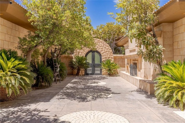 9801 Orient Express Ct, Las Vegas, NV 89145 - view of patio featuring french doors and exterior fireplace