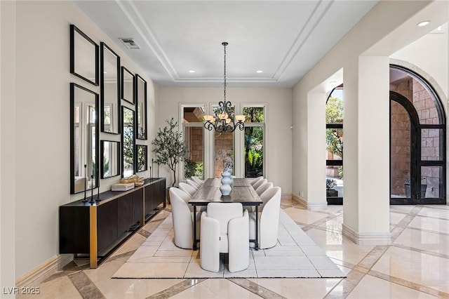9801 Orient Express Ct, Las Vegas, NV 89145 - dining area with inlaid floor details, recessed lighting, a raised ceiling, a chandelier, and arched walkways