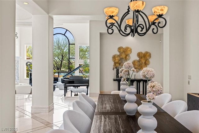 9801 Orient Express Ct, Las Vegas, NV 89145 - dining area featuring a chandelier, light tile patterned floors, and inlaid floor details