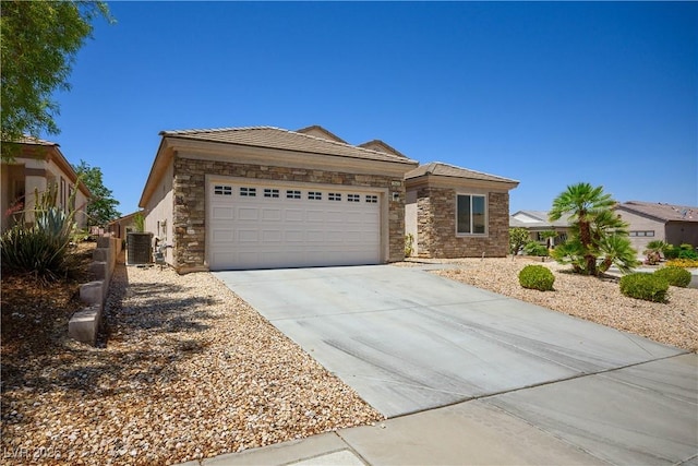 2563 Sargon St, Henderson, NV 89044 - ranch-style home featuring stone siding, driveway, and a garage