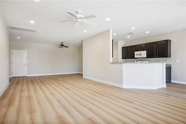 2563 Sargon St, Henderson, NV 89044 - unfurnished living room featuring a ceiling fan, light wood-style flooring, and recessed lighting
