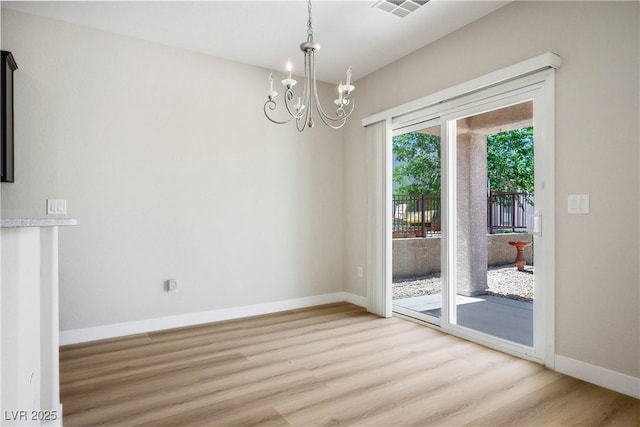 2563 Sargon St, Henderson, NV 89044 - unfurnished dining area with light wood-type flooring and a chandelier