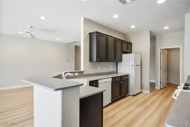 2563 Sargon St, Henderson, NV 89044 - kitchen with a ceiling fan, light wood-type flooring, light countertops, recessed lighting, and white appliances