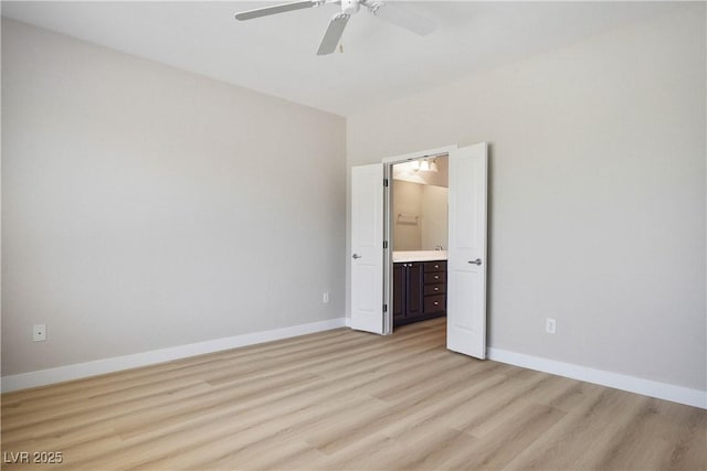 2563 Sargon St, Henderson, NV 89044 - unfurnished bedroom featuring light wood-style floors, a ceiling fan, and connected bathroom