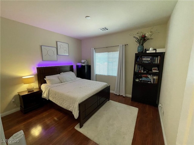 5625 Fast Payout Ct, Las Vegas, NV 89122 - bedroom with wood finished floors and baseboards
