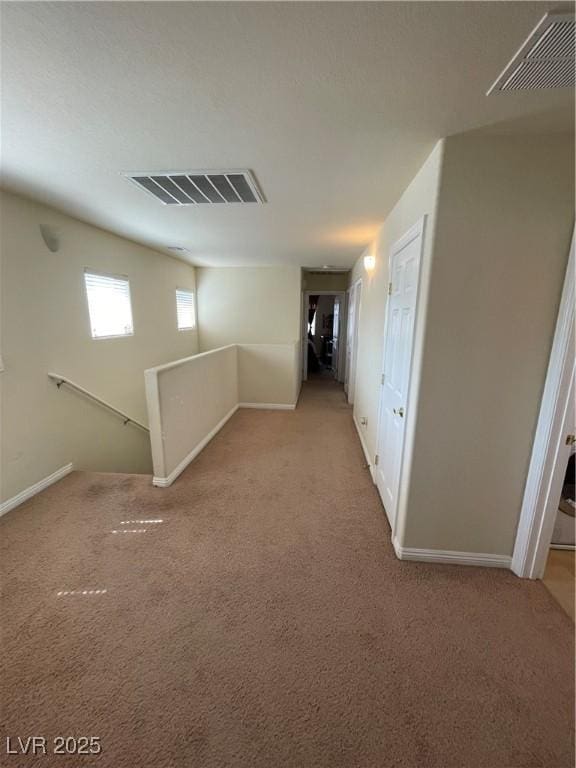 5625 Fast Payout Ct, Las Vegas, NV 89122 - hallway with an upstairs landing and light colored carpet