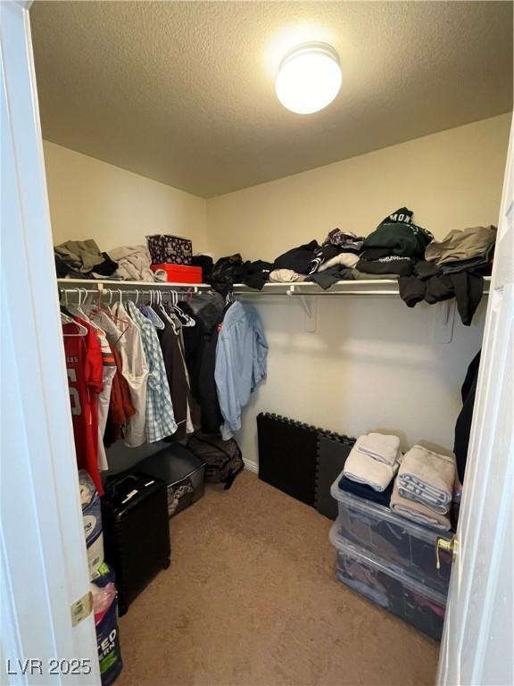 5625 Fast Payout Ct, Las Vegas, NV 89122 - spacious closet featuring carpet floors